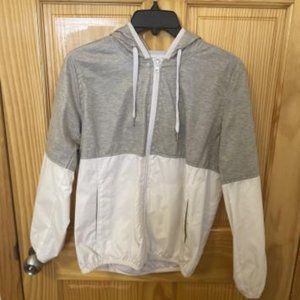white and grey windbreaker